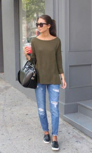 green long-sleeved t-shirt with a boat neckline and ripped slim fit jeans