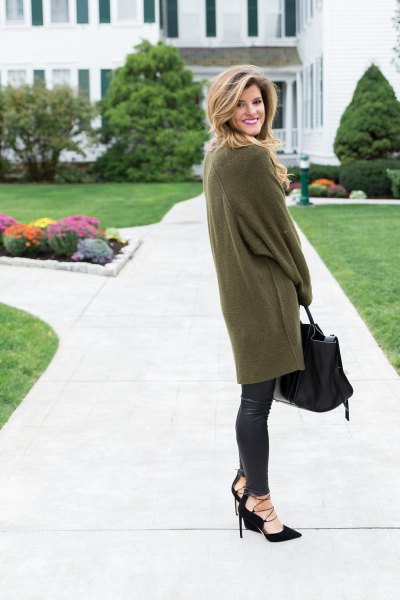 green oversized tunic sweater with long sleeves and black leather gaiters