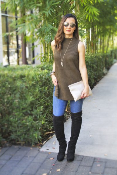 green mock neck torn long sweater with black overknee boots
