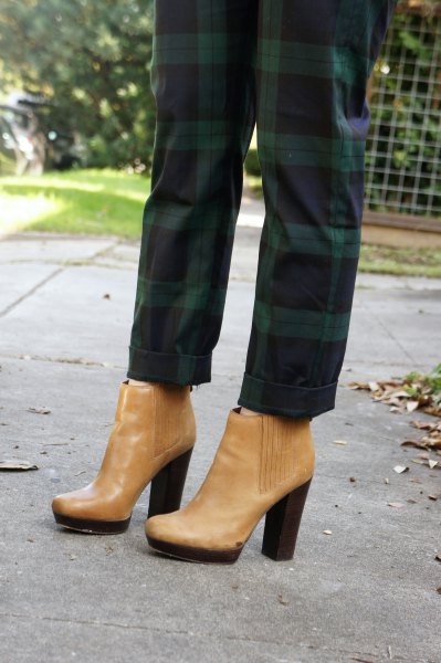 green plaid pants with light brown leather boots with ankle heel