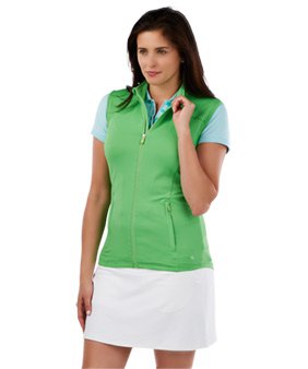 green sleeveless polo sweater with light blue T-shirt and white mini skirt