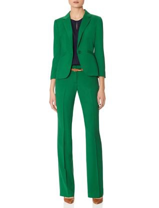 green suit jacket with high-waisted straight-leg trousers