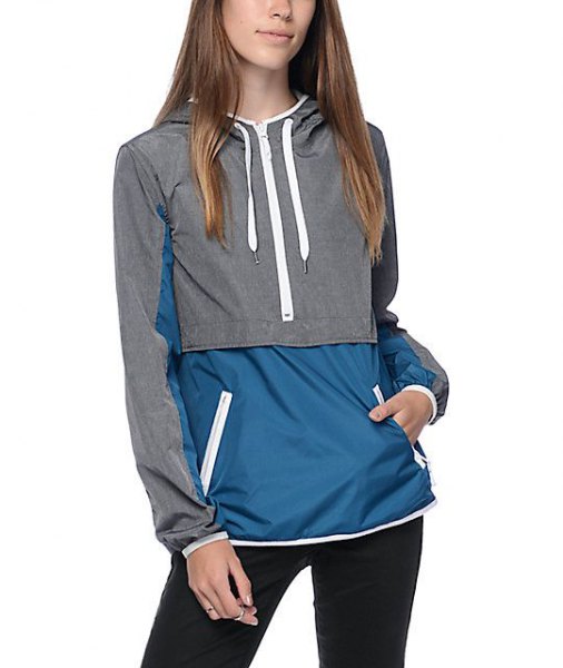 gray and dark blue color-block sweater sports jacket with dark jeans