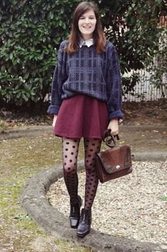 gray and dark blue sweater with brown shorts and tights with a polka dot pattern