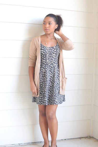 gray and white floral mini swing dress with an ivory-colored cardigan
