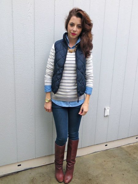 gray and white striped sweater over a light blue chambray shirt