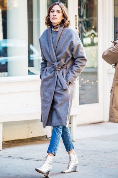 gray coat with belt and silver leather boots
