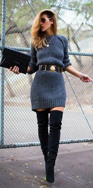 gray sweater dress with belt and overknee boots made of black suede