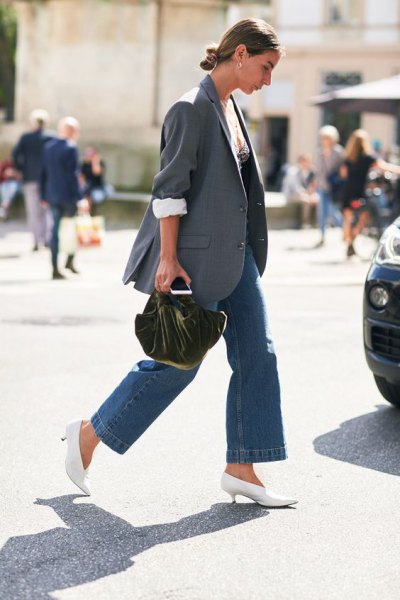 gray blazer with blue wide-leg jeans and white boots with kitten heels