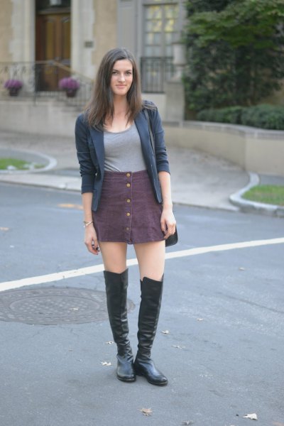 gray skirt with buttons over knee leather boots