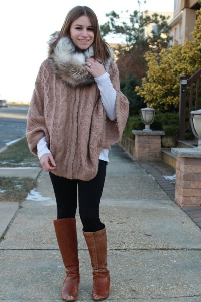 gray knitted sweater with cable pattern and infinity scarf made of faux fur