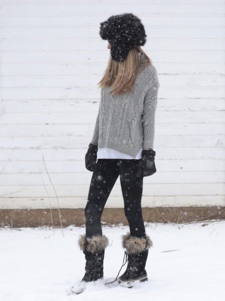 gray cable knit sweater with white shirt with buttons and snowshoes made of faux fur
