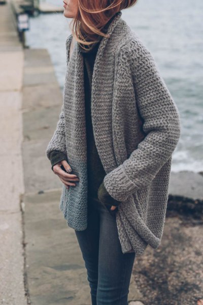 gray, coarsely knitted cardigan with mock-neck sweater and skinny jeans