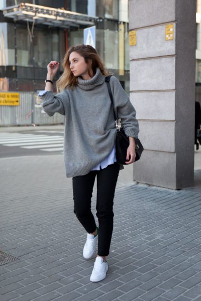 gray, chunky sweater with light blue chambray shirt and white sneakers