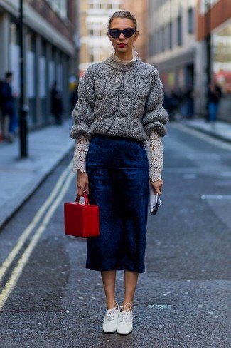gray, chunky sweater with dark blue midi skirt and white leather shoes