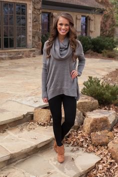 gray sweater with cowl neckline, black leggings and camel ankle boots