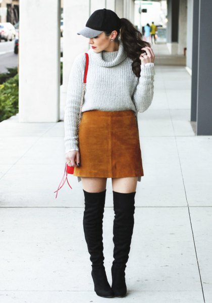 gray sweater with cowl neckline, brown suede skirt and black overknee boots