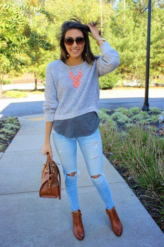 gray shortened sweater with round neckline over a long T-shirt