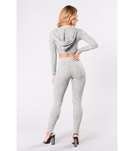 gray cropped hoodie with matching leggings and high-waisted heels