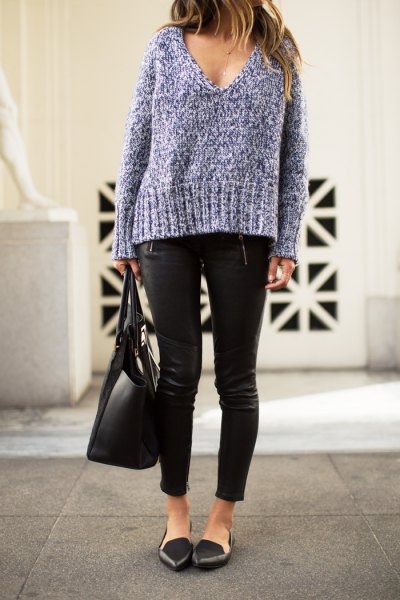 gray, coarsely knitted sweater with deep V-neckline, leather pants and black, pointed flats