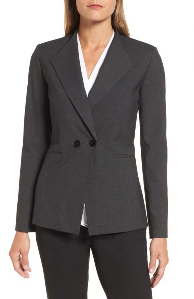 gray double-breasted slim fit suit with white blouse with V-neck