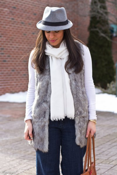 gray faux fur vest with white long-sleeved T-shirt and matching scarf