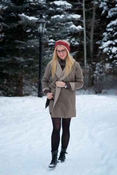 gray wrap dress made of fleece with stockings and black snowshoes