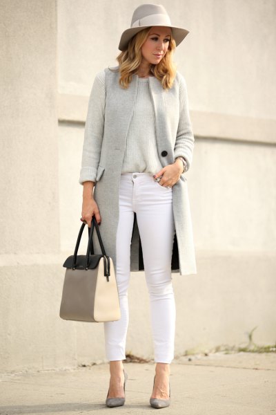 gray floppy hat with matching vest and white, cropped jeans