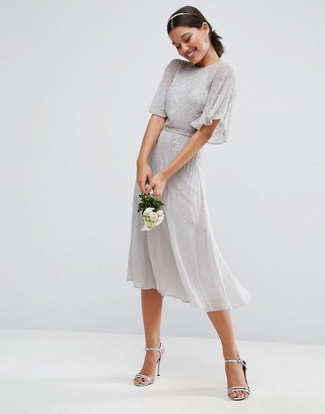 gray midi dress with a gathered waist and fluttering sleeves