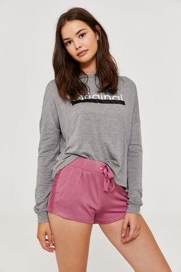 gray graphic sweatshirt with blushing pink high-waisted sweat shorts