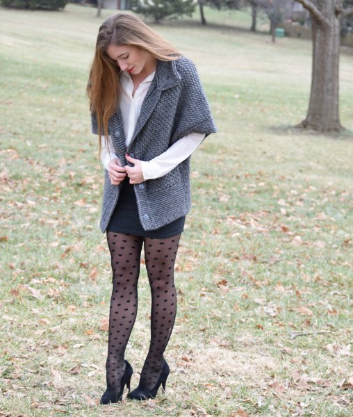 gray cardigan with half sleeves, black, figure-hugging mini skirt and dotted tights