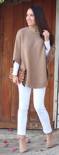 gray half-sleeved sweater with white long-sleeved T-shirt and slim-fit jeans