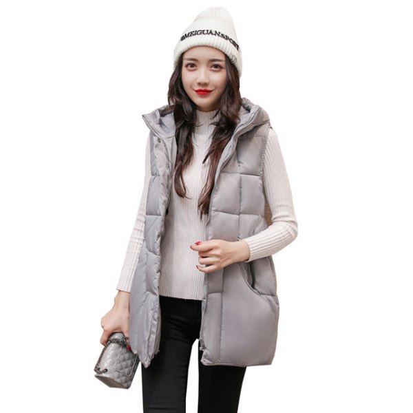 gray down vest with hood and white, ribbed sweater with stand-up collar