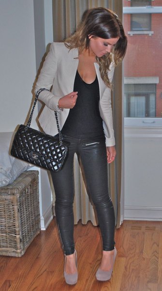 gray jacket with tank top with scoop neckline and leather pants