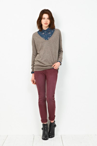 gray sweater with dark blue, printed shirt and jeans