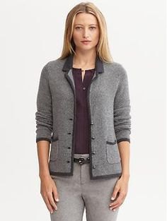 gray knitted blazer with black top and thin cotton trousers