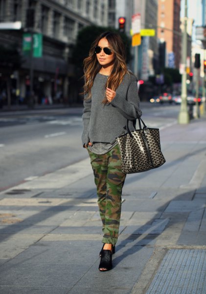 gray knitted sweater with straight leg camo jeans and black ballerinas