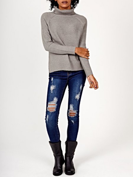 gray knitted sweater with ripped skinny jeans