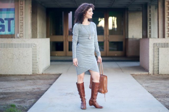 gray, long-sleeved, figure-hugging bandage dress with knee-high boots made of brown leather with side zip