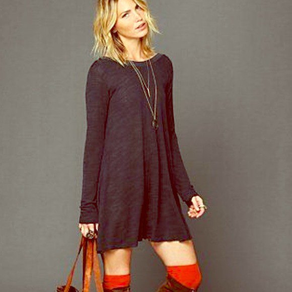 gray long-sleeved swing dress with knee-high boots made of brown suede