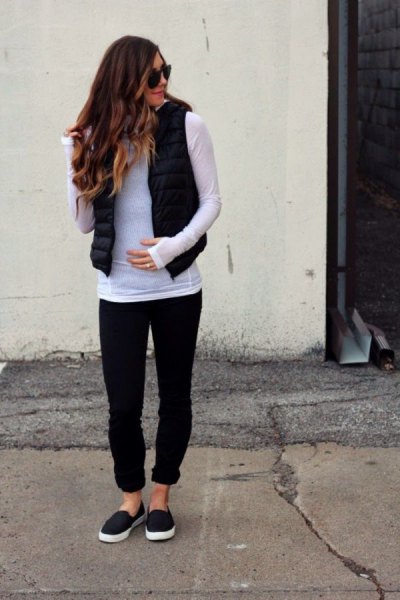 gray long-sleeved T-shirt with black puffer vest and cuffed jeans