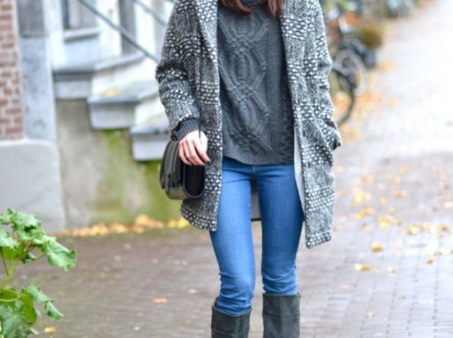 gray long sweater with light blue jeans and black knee-high boots