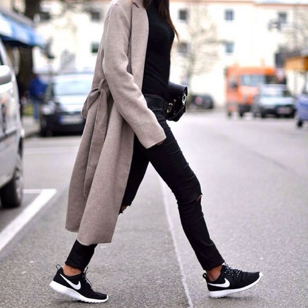 gray longline coat with black coated skinny jeans