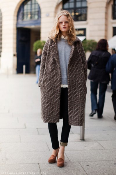 gray longline coat with sweater and black jeans