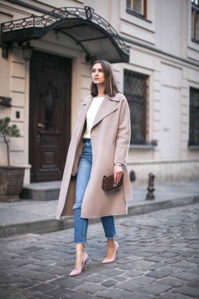 gray winter wool coat with a long line and blue, narrow-cut jeans