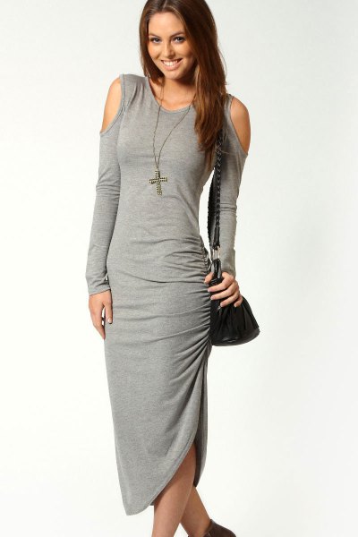 gray, figure-hugging dress with open shoulder and boots