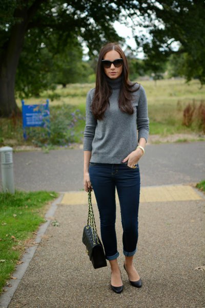 gray cashmere sweater with mock neck and dark blue skinny jeans with cuffs