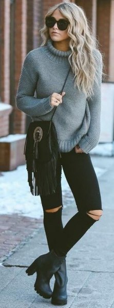 gray knitted sweater with mock neck and black skinny jeans