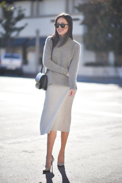 gray sweater with stand-up collar and knee-length skirt