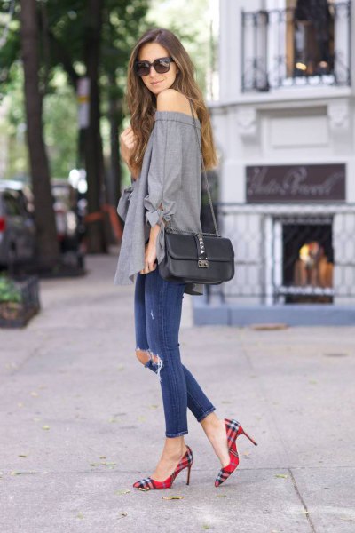 gray strapless blouse with blue ripped ankle jeans and checkered shoes